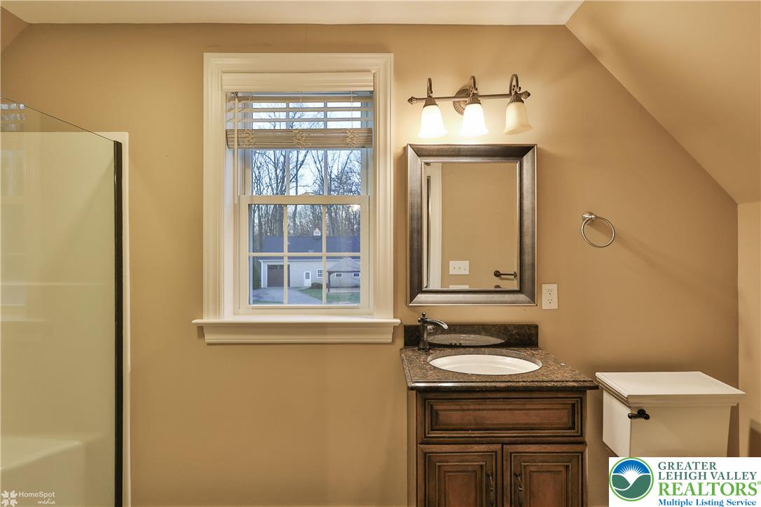 284 Walker Road Macungie, PA 18062 - Photo 83 of 99 a bathroom with a sink and a mirror