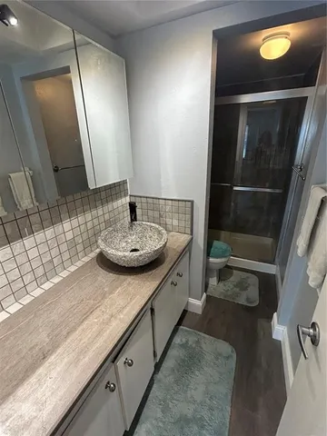 a view of a balcony with wooden floor