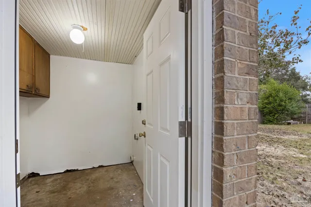 a view of a house with a backyard and sitting area