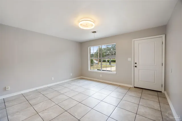 a view of an empty room and window