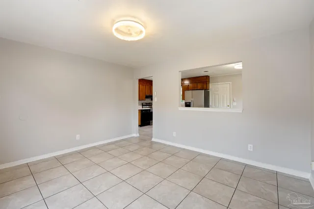 a kitchen with stainless steel appliances a refrigerator and a stove top oven