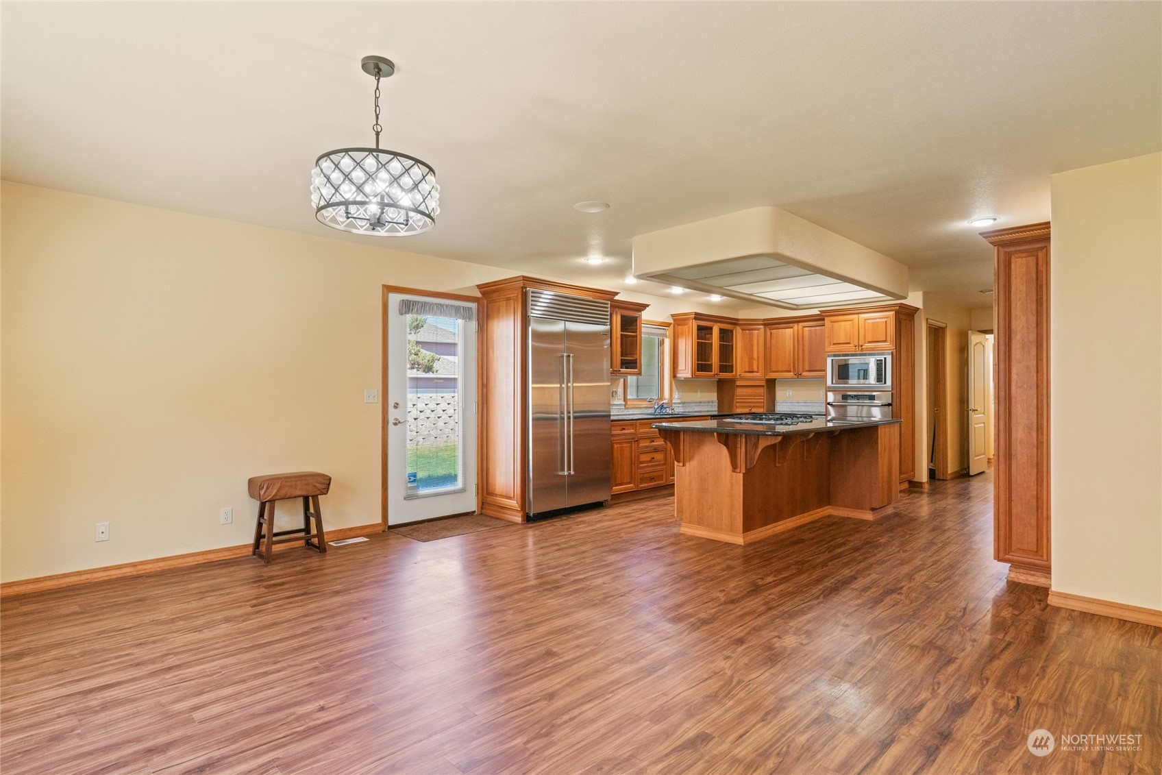 8 Valley View Park Road Omak, WA 98841 - Photo 12 of 40 a view of a room with wooden floor and chandelier
