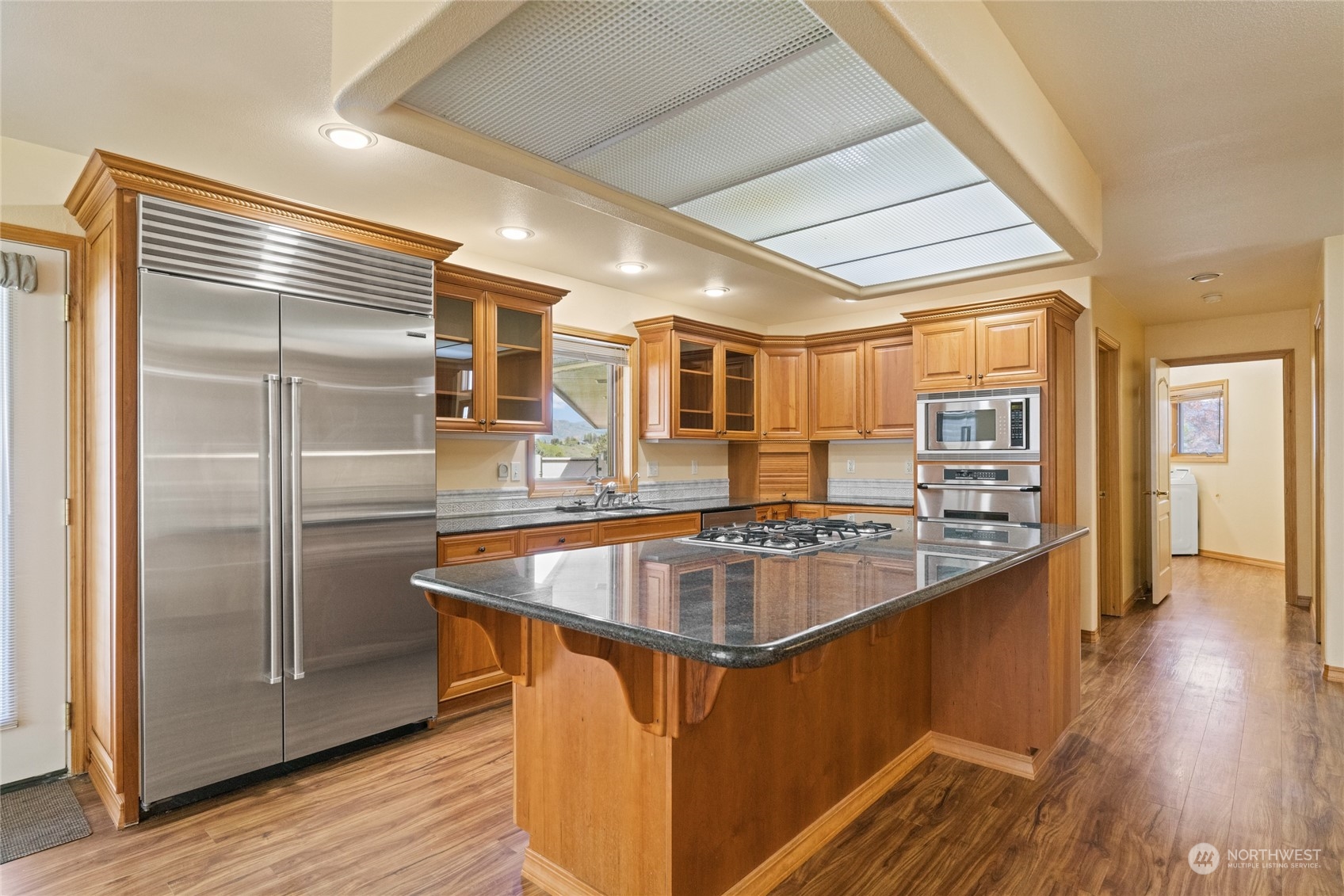 8 Valley View Park Road Omak, WA 98841 - Photo 13 of 40 a kitchen with stainless steel appliances granite countertop a refrigerator a sink and a stove