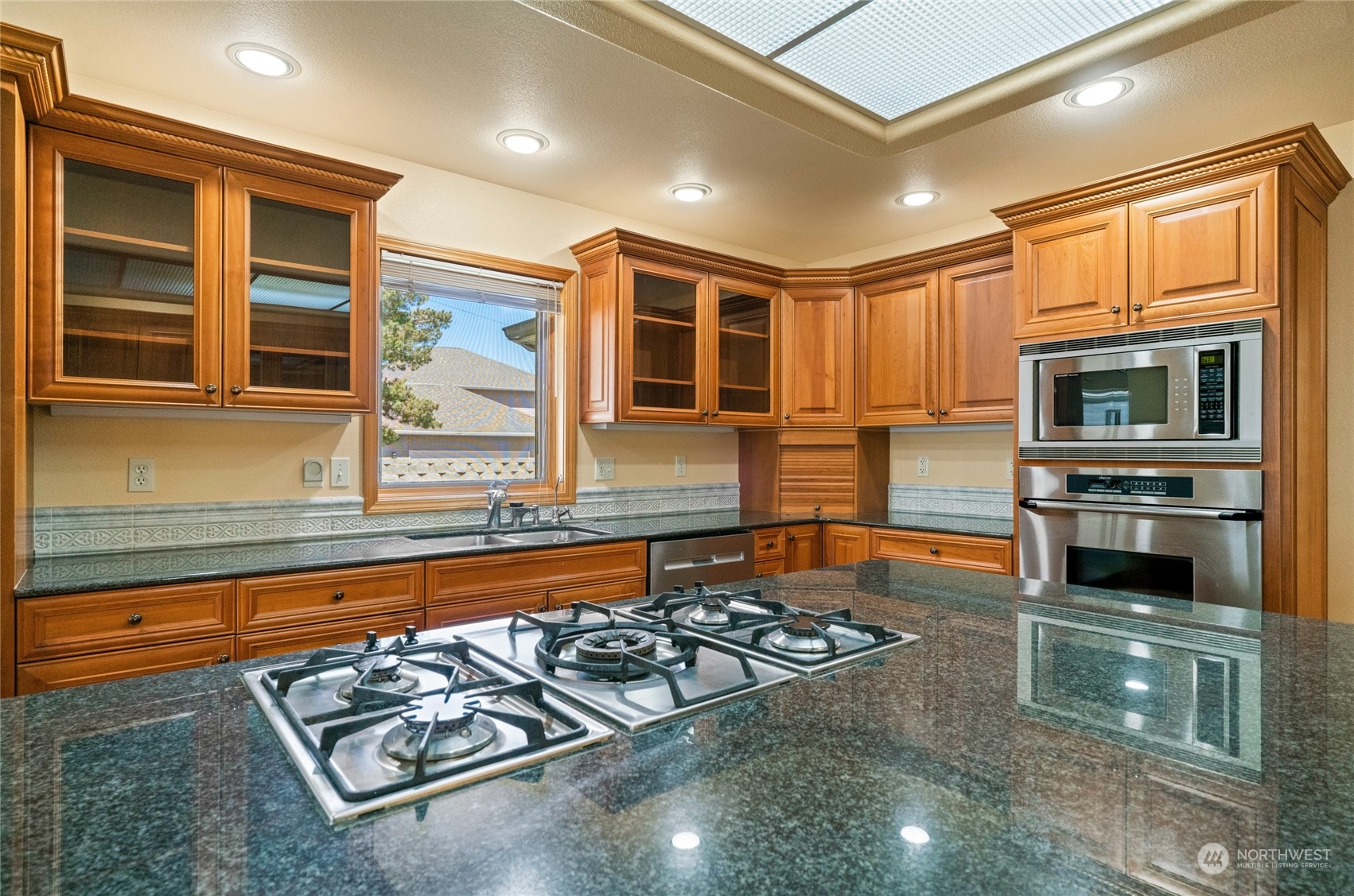 8 Valley View Park Road Omak, WA 98841 - Photo 14 of 40 a kitchen with stainless steel appliances granite countertop a stove and a sink