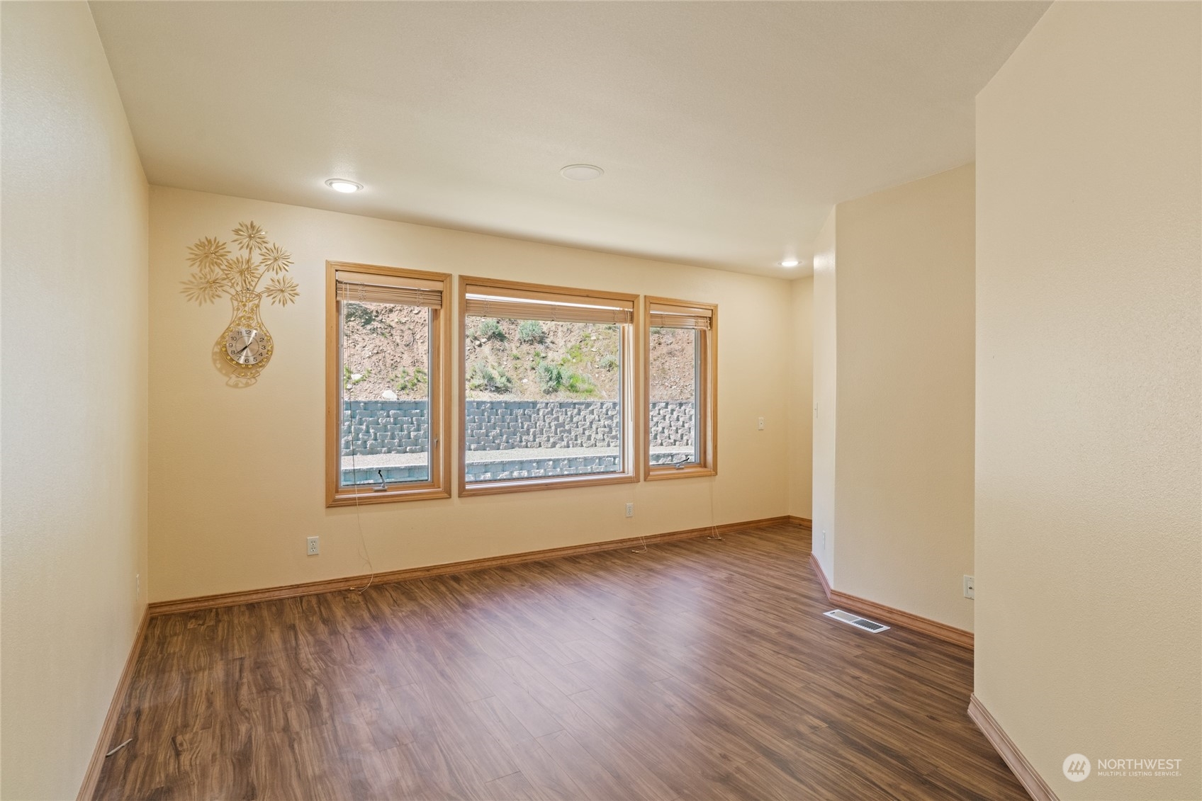 8 Valley View Park Road Omak, WA 98841 - Photo 29 of 40 an empty room with wooden floor and a window