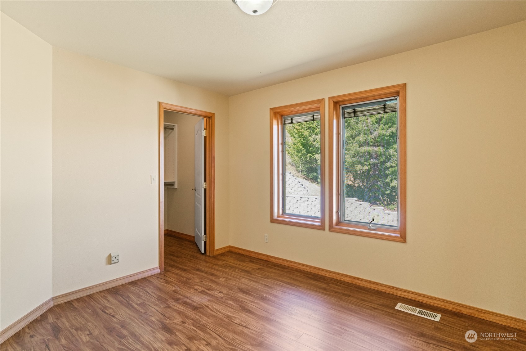 8 Valley View Park Road Omak, WA 98841 - Photo 33 of 40 an empty room with wooden floor and windows