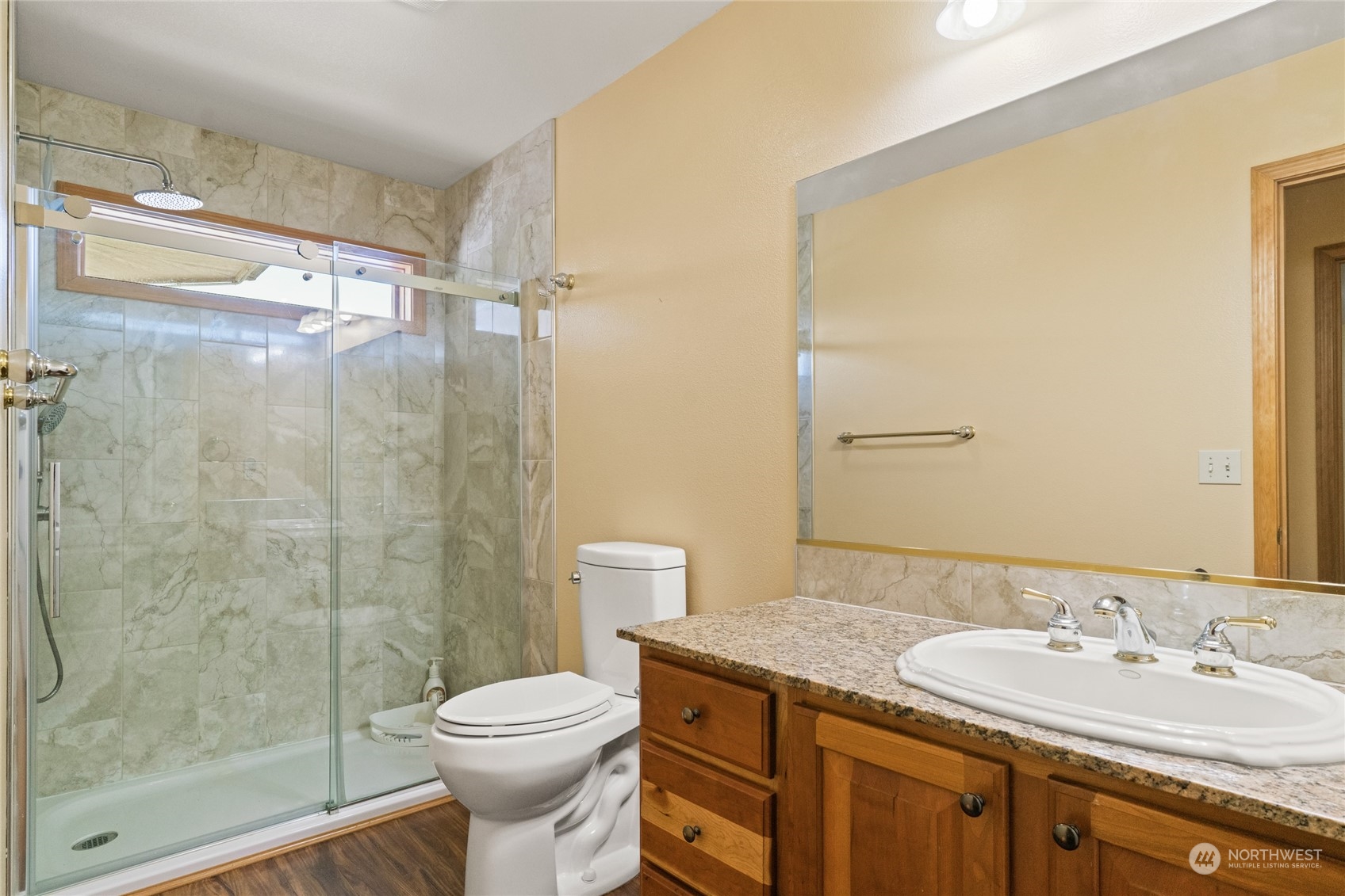 8 Valley View Park Road Omak, WA 98841 - Photo 35 of 40 a bathroom with a granite countertop toilet sink and shower