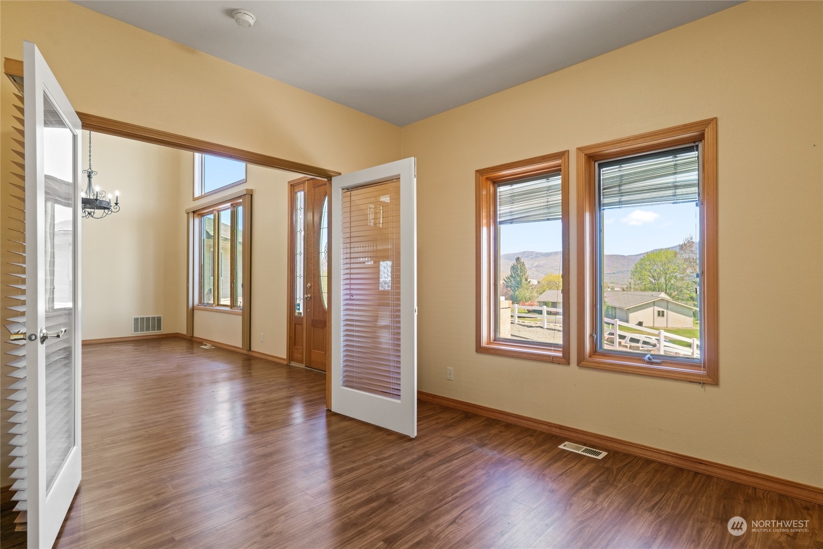 8 Valley View Park Road Omak, WA 98841 - Photo 36 of 40 an empty room with wooden floor and windows