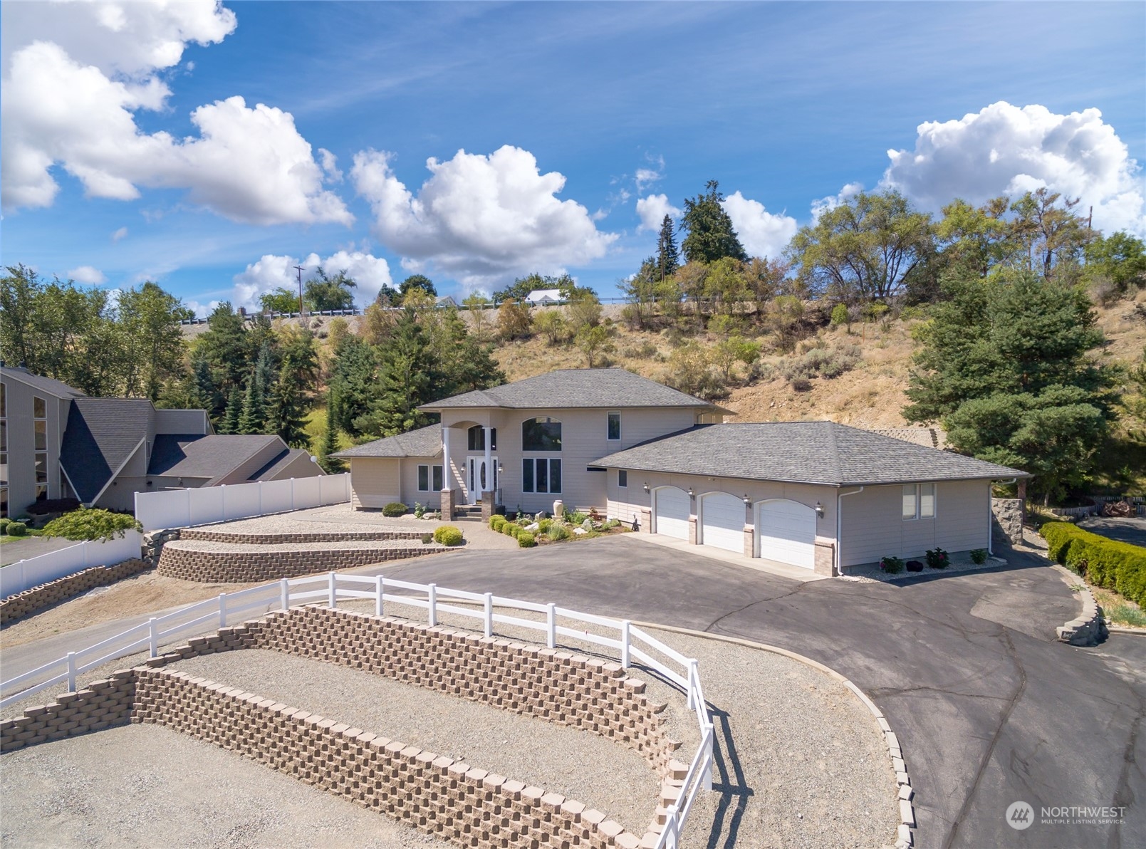 8 Valley View Park Road Omak, WA 98841 - Photo 38 of 40 a front view of a house with a garden and patio