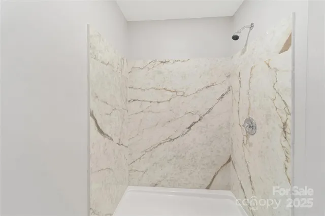 a view of an empty room with windows