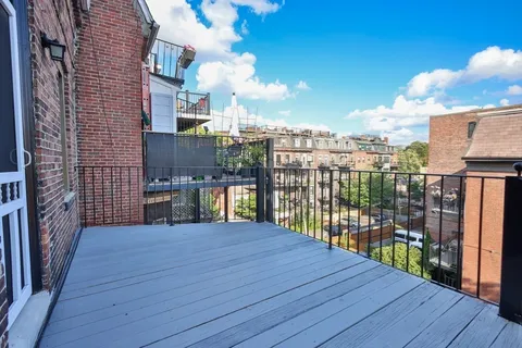 a view of a terrace with wooden floor