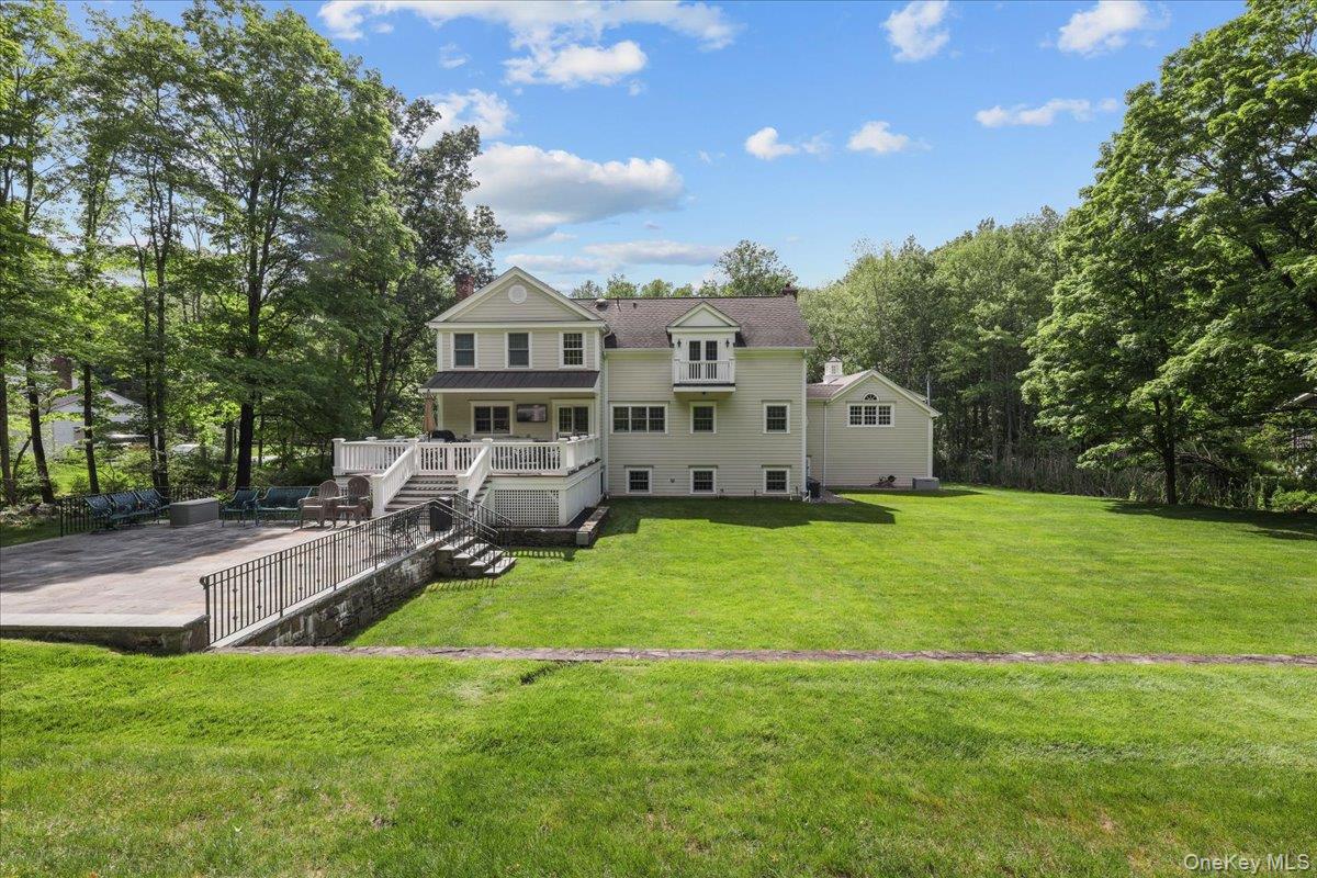 135 Pines Bridge Road Katonah, NY 10536 - Photo 36 of 40 a view of a house with backyard and sitting area
