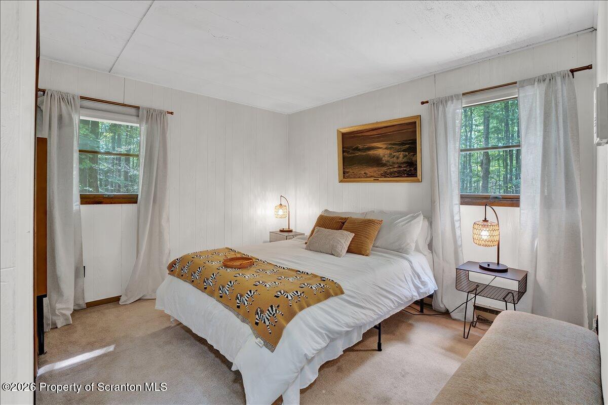 58 Sheffick Road Gouldsboro, PA 18424 - Photo 16 of 44 a bedroom with a bed and a window