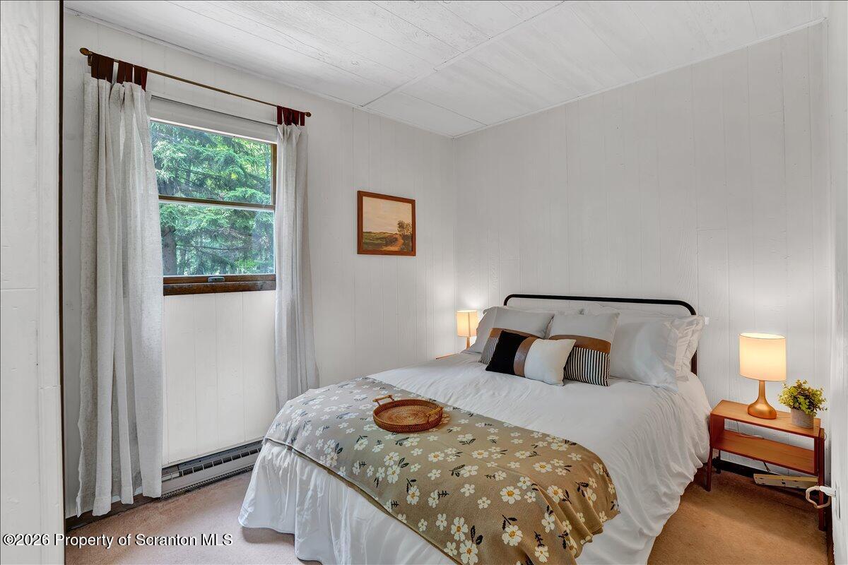 58 Sheffick Road Gouldsboro, PA 18424 - Photo 19 of 44 a bedroom with a bed and window