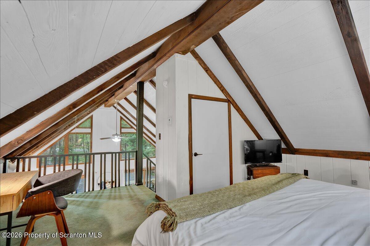 58 Sheffick Road Gouldsboro, PA 18424 - Photo 22 of 44 a bedroom with a bed and a large window