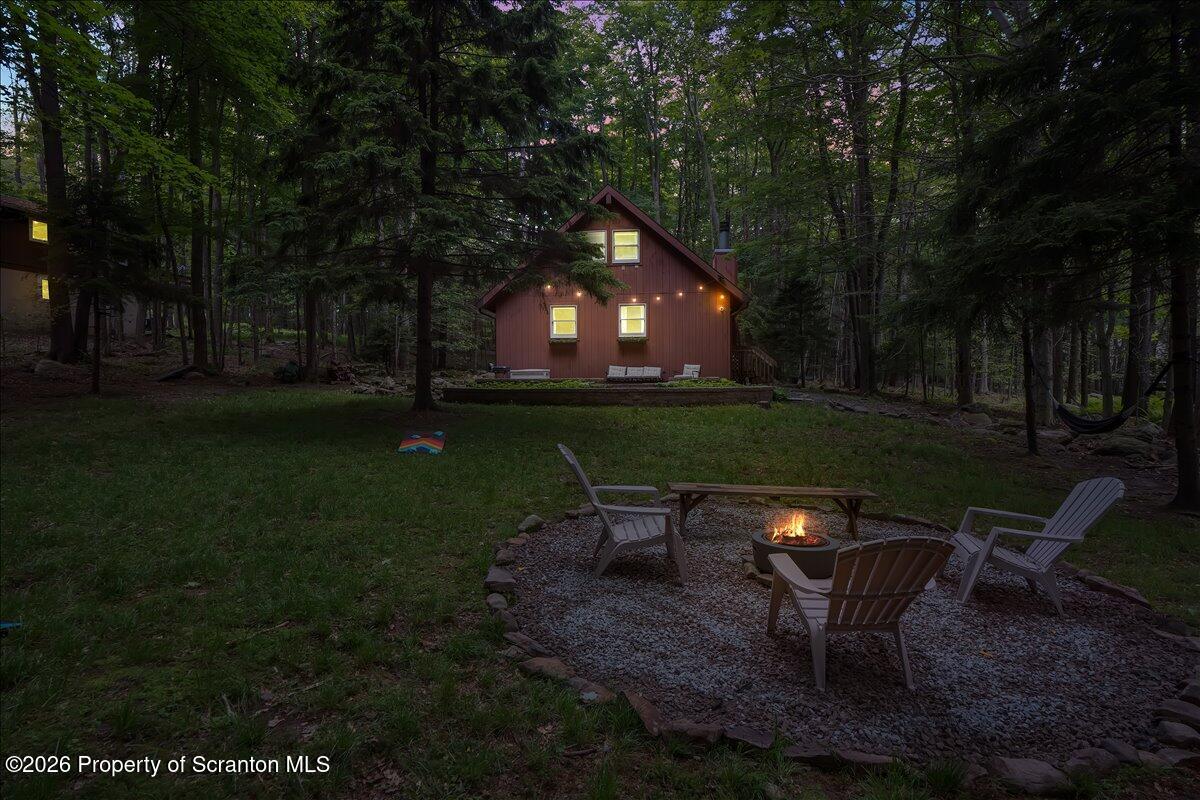 58 Sheffick Road Gouldsboro, PA 18424 - Photo 38 of 44 a backyard of a house with table and chairs