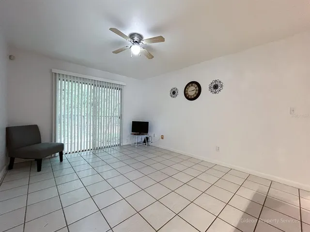 a view of an empty room with a window