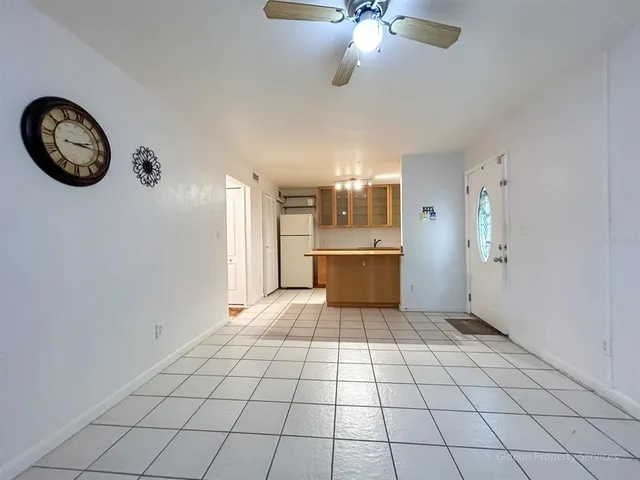 a view of a kitchen with a stove cabinets and a refrigerator