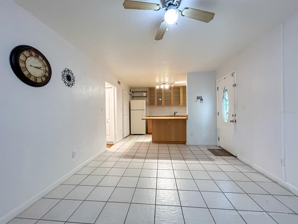 1015 Southwest 9th Street, Unit D2 Gainesville, FL 32601 - Photo 4 of 14 a view of a kitchen with a stove cabinets and a refrigerator