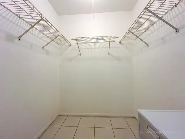 a view of small space with empty racks on the wall