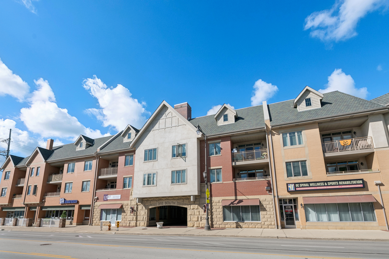 310 South Main Street, Unit 314 Lombard, IL 60148 - Photo 1 of 18 a view of multiple houses with a street