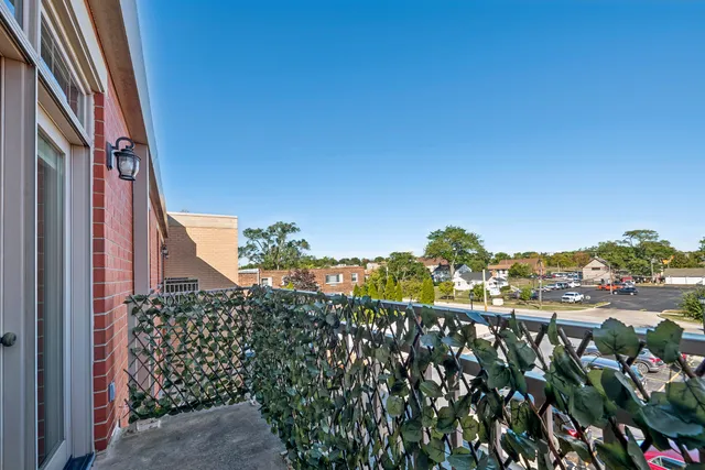 a view of a house with a flower garden