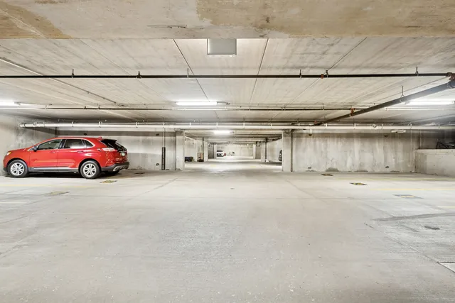 a view of parking area with car parked