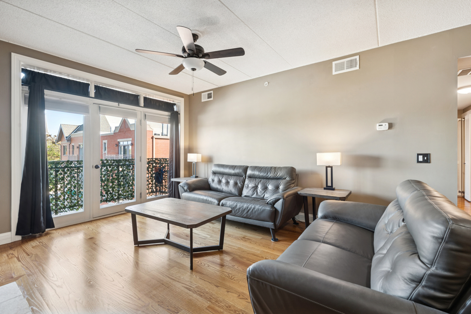310 South Main Street, Unit 314 Lombard, IL 60148 - Photo 4 of 18 a living room with furniture and a wooden floor