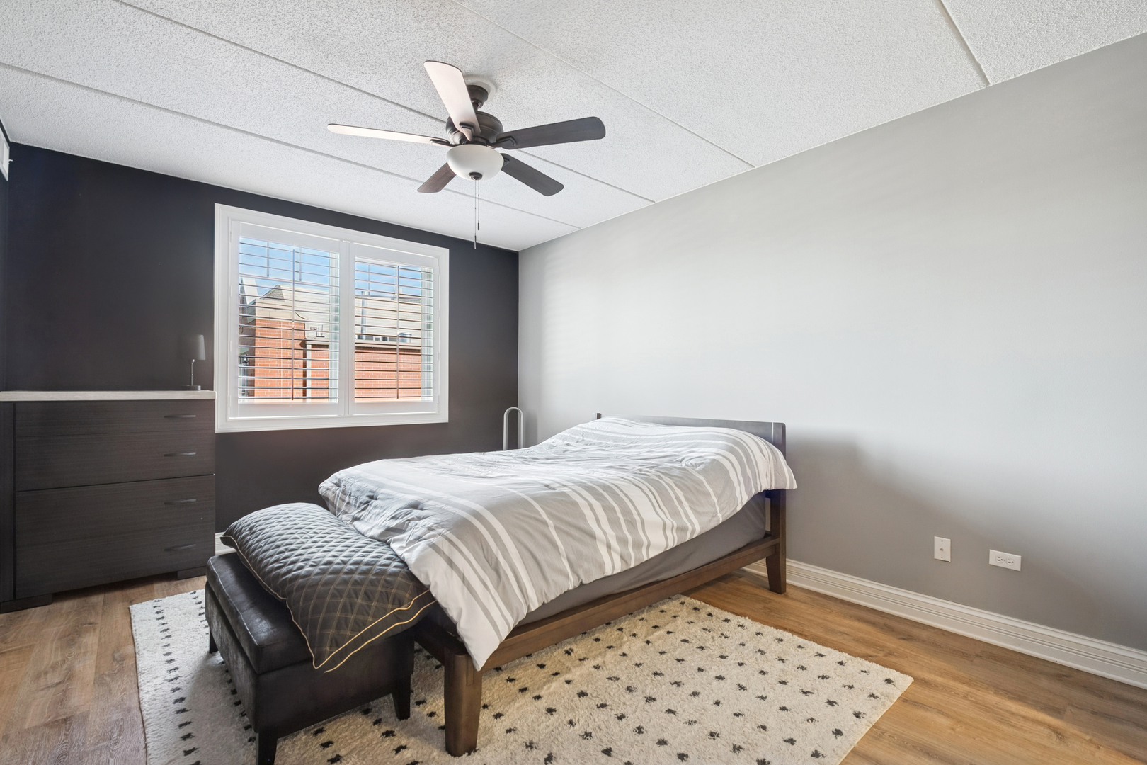 310 South Main Street, Unit 314 Lombard, IL 60148 - Photo 8 of 18 a bedroom with a bed and a window