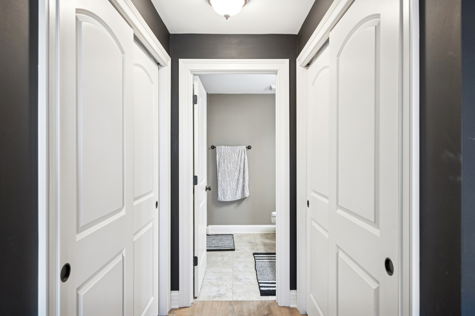 310 South Main Street, Unit 314 Lombard, IL 60148 - Photo 9 of 18 a bathroom with a glass shower door and mirror