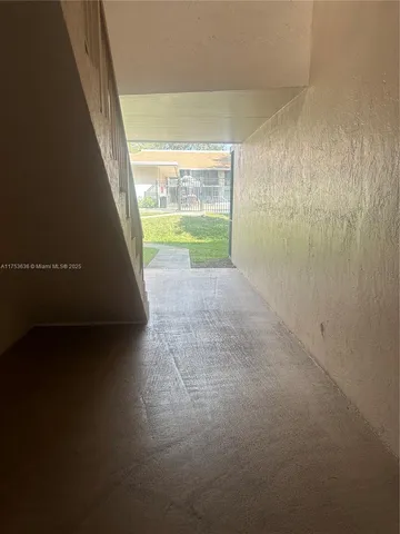 a view of a big room with wooden floor