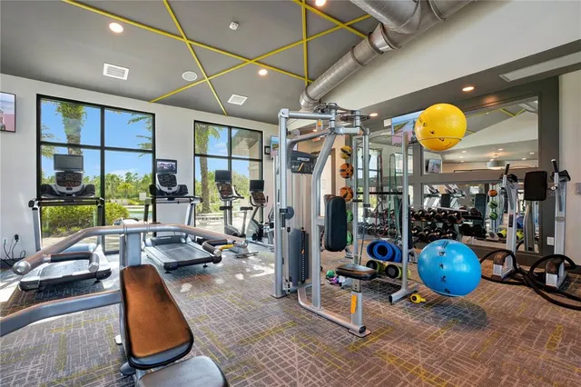 a lobby with furniture and a ceiling fan