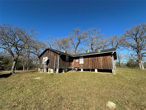 a view of a yard with outside space
