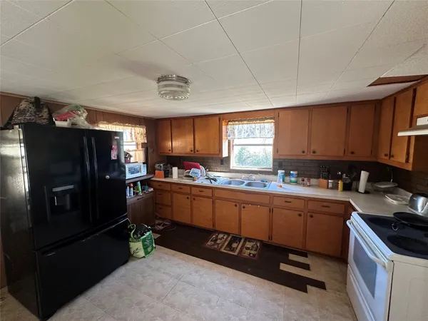 a view of a a dining room with furniture window and outside view