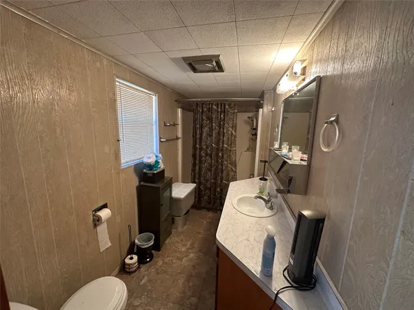 a living room with furniture window and a fireplace