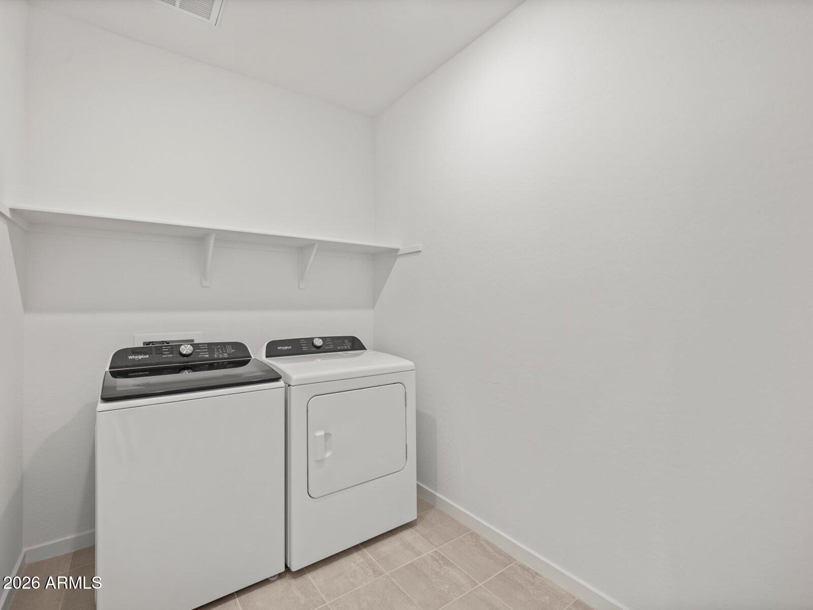 8936 South 244th Lane Buckeye, AZ 85326 - Photo 10 of 45 a utility room with dryer and washer
