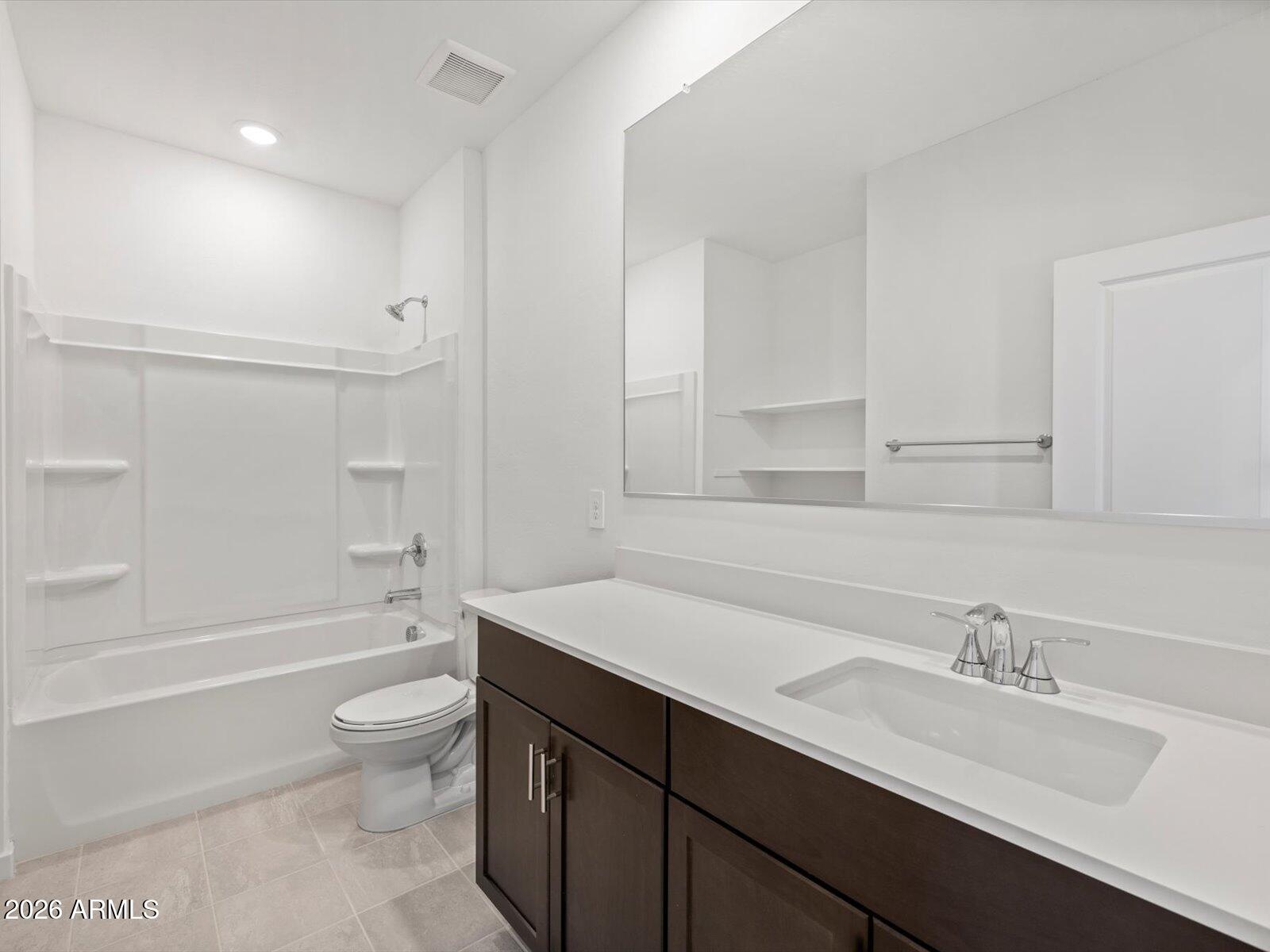 8936 South 244th Lane Buckeye, AZ 85326 - Photo 11 of 45 a bathroom with a sink double vanity granite toilet tub and shower