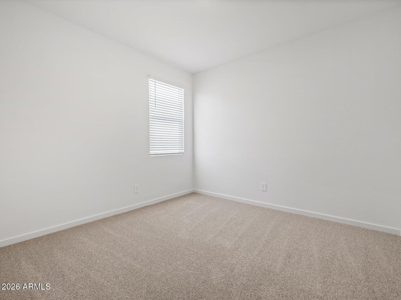 8936 South 244th Lane Buckeye, AZ 85326 - Photo 16 of 45 an empty room with windows