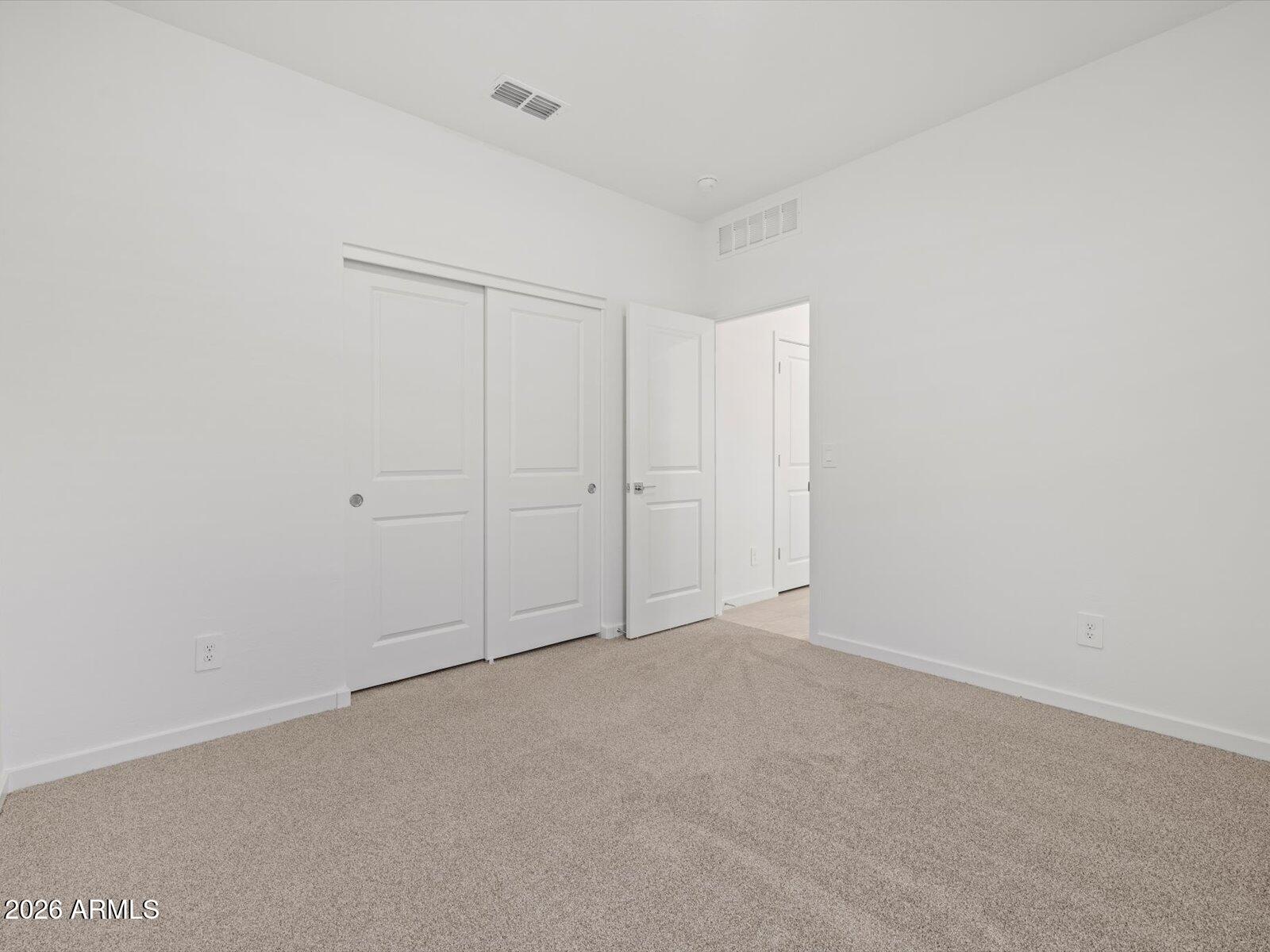8936 South 244th Lane Buckeye, AZ 85326 - Photo 17 of 45 an empty room with an entryway