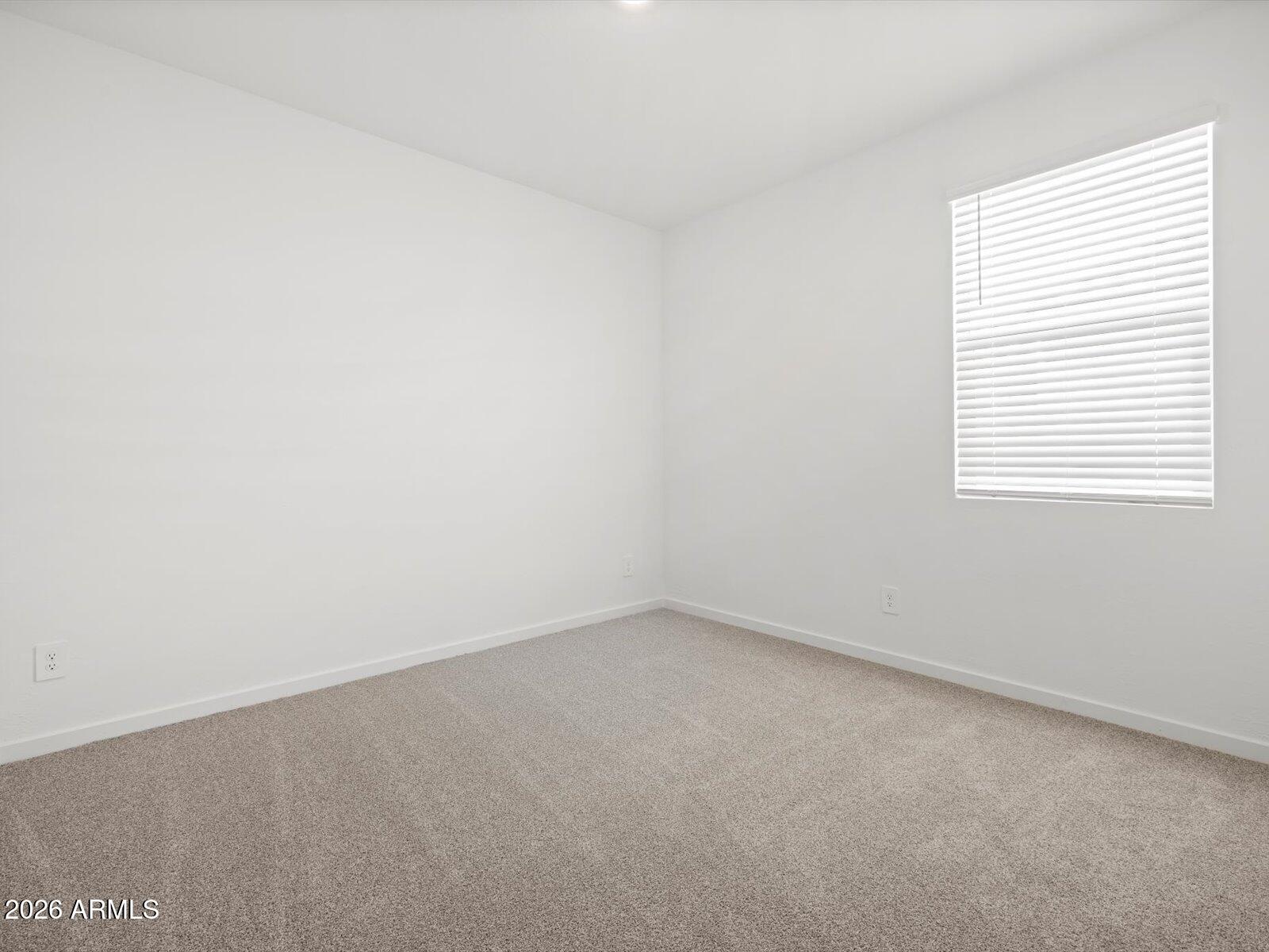 8936 South 244th Lane Buckeye, AZ 85326 - Photo 18 of 45 an empty room with a window