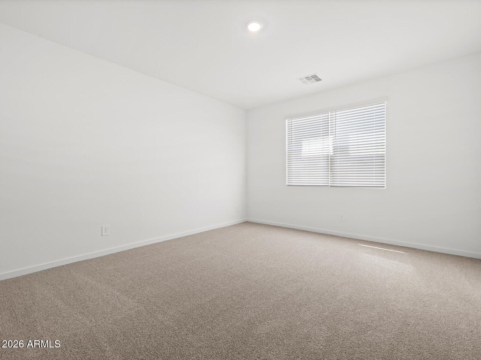 8936 South 244th Lane Buckeye, AZ 85326 - Photo 20 of 45 an empty room with a window