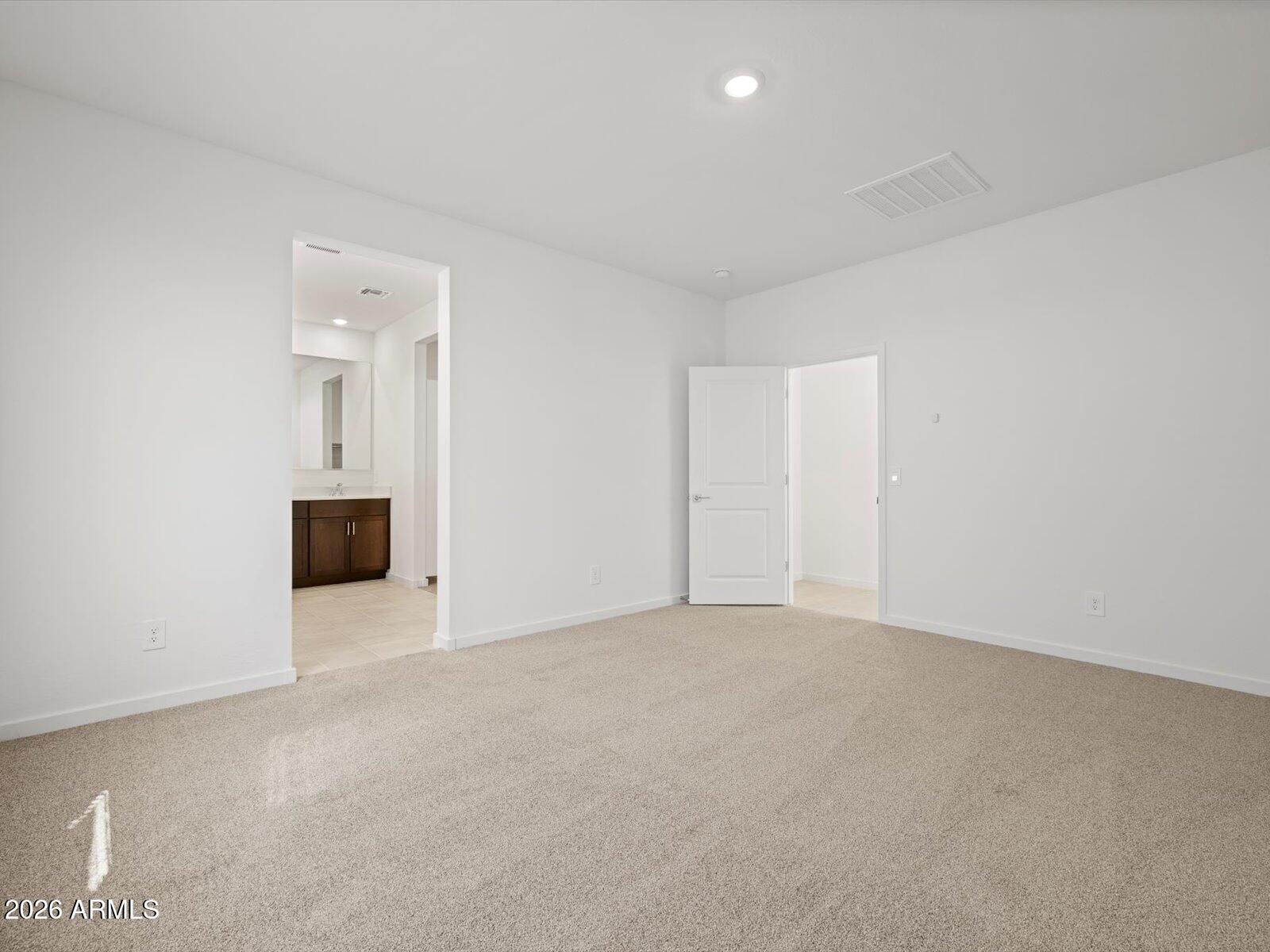 8936 South 244th Lane Buckeye, AZ 85326 - Photo 21 of 45 an empty room with a window and a fireplace