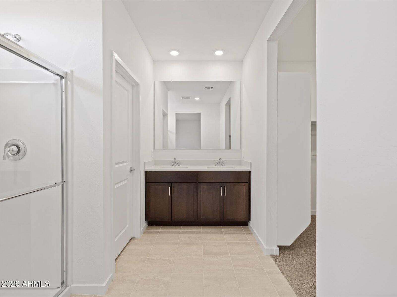 8936 South 244th Lane Buckeye, AZ 85326 - Photo 22 of 45 a bathroom with a sink and a mirror