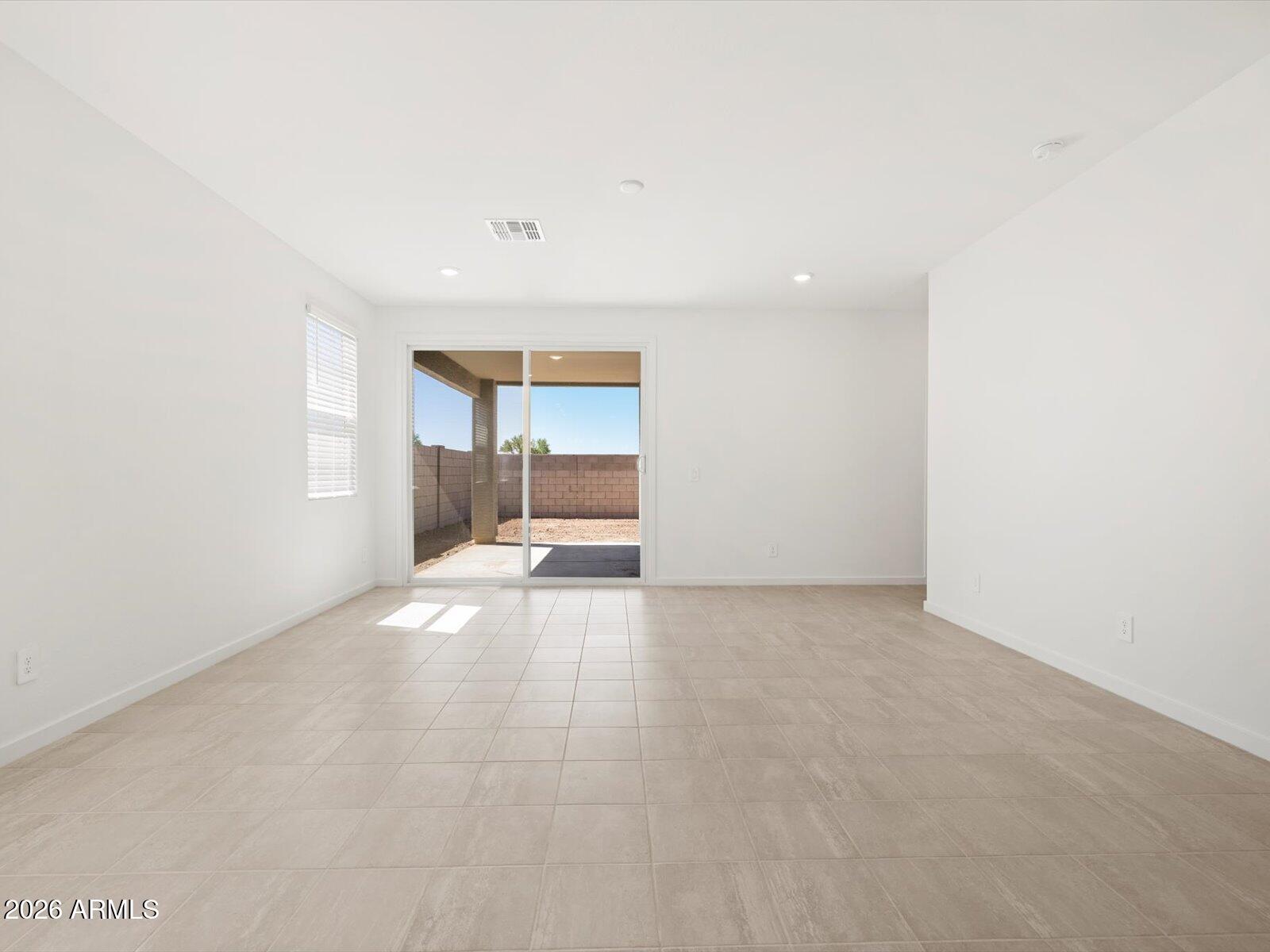 8936 South 244th Lane Buckeye, AZ 85326 - Photo 32 of 45 a view of empty room with a fireplace