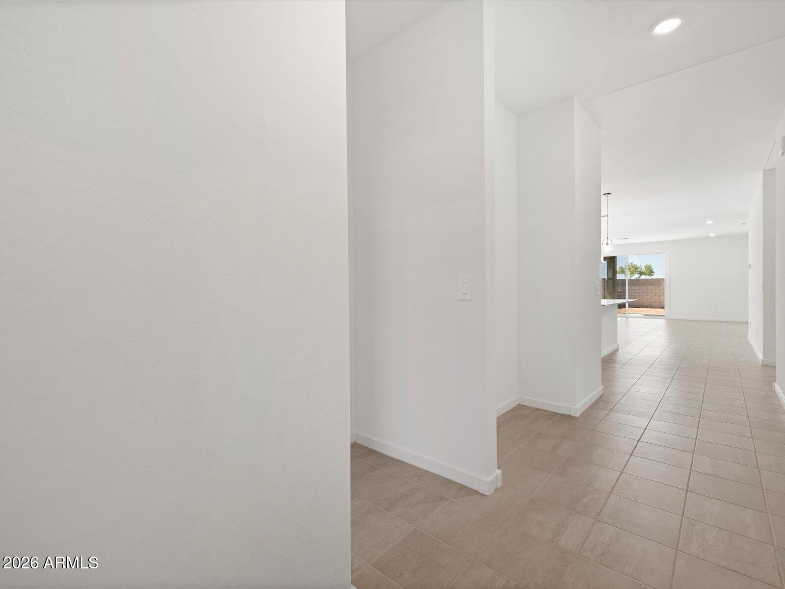8936 South 244th Lane Buckeye, AZ 85326 - Photo 3 of 45 a view of a hallway with a bathroom