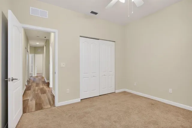 wooden floor and closet in a room