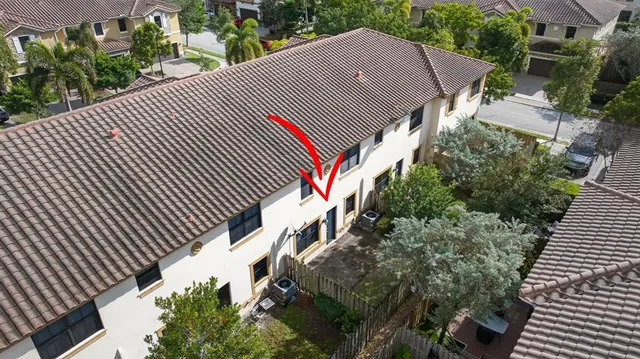 a aerial view of a house with a yard