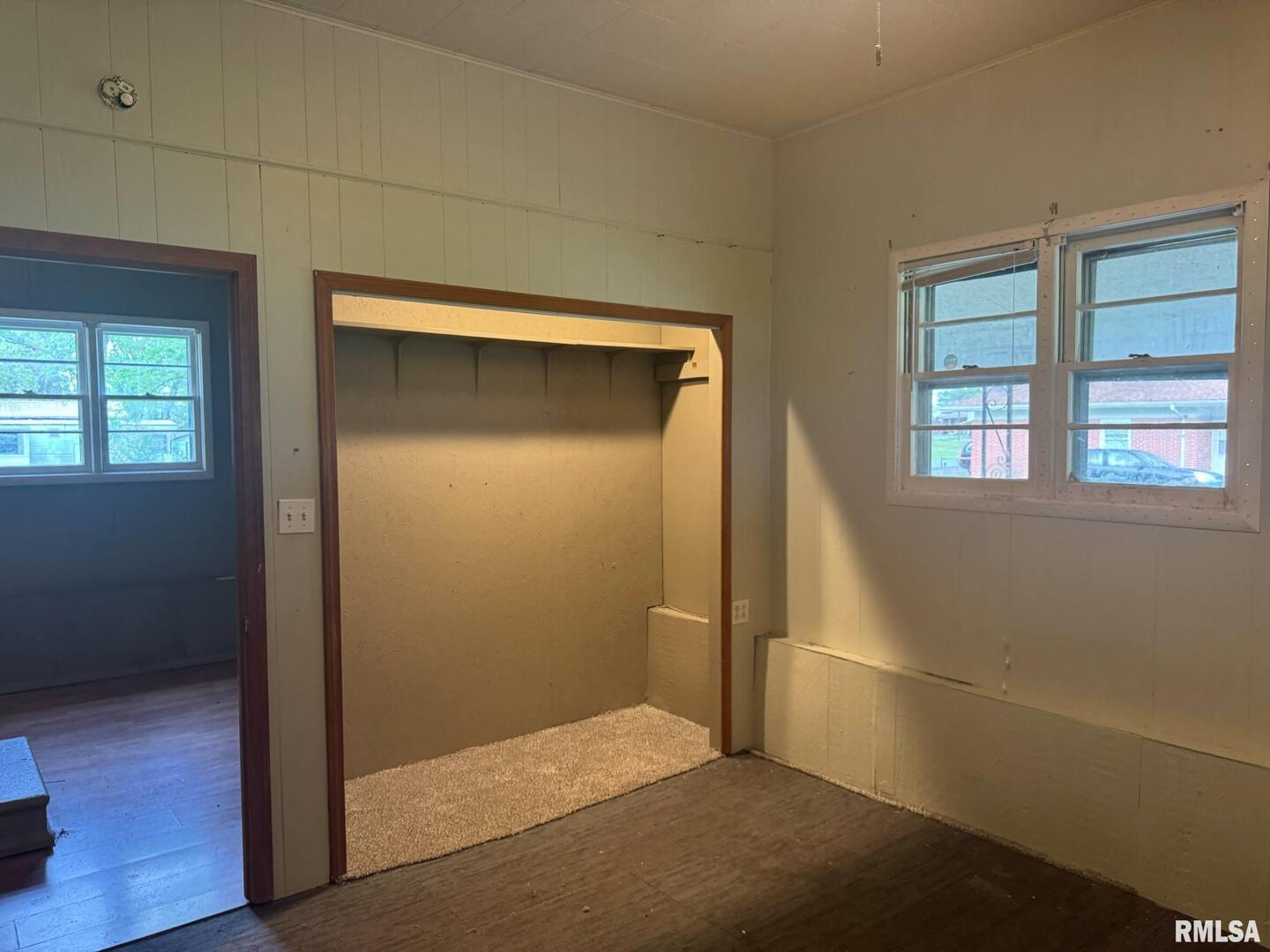 604 South 23rd Street Herrin, IL 62948 - Photo 12 of 14 a view of an empty room with wooden floor and a window