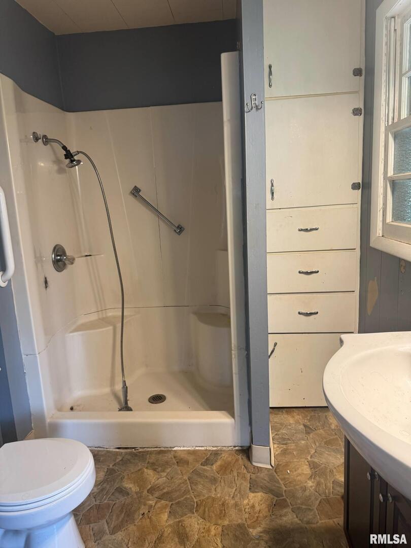 604 South 23rd Street Herrin, IL 62948 - Photo 14 of 14 a bathroom with a shower and a toilet