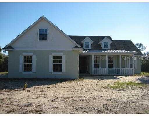 4019 Marsh Road DeLand, FL 32724 - Photo 1 of 1 a front view of a house with a yard
